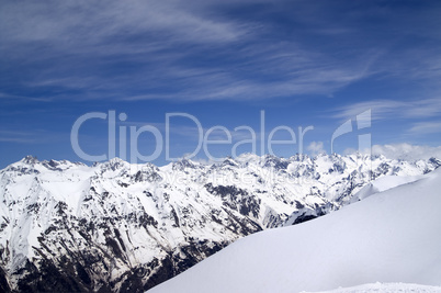 Off-piste slope and snowy mountains