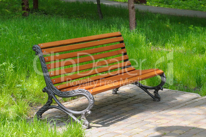 park bench and green lawn