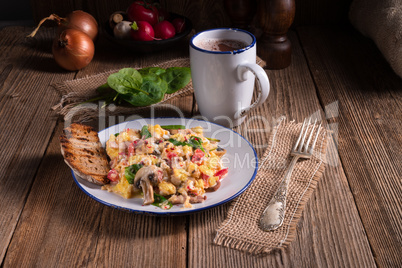 Scrambled eggs with tomatoes and spinach