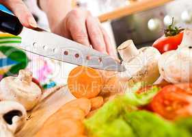 Woman's hands cutting vegetables