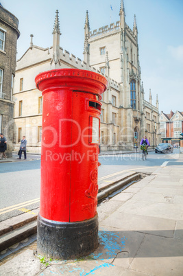 Famous red post box on a street in Cambridge, UK