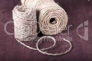 skein of twine on a brown background