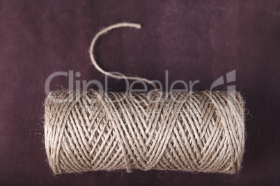 skein of twine on a brown background