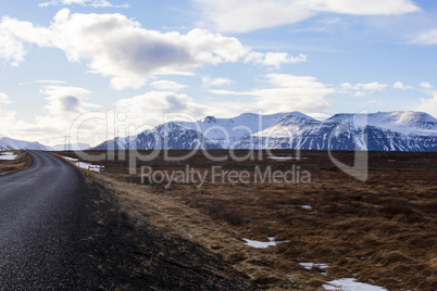 Snowy volcano landscape with dramatic clouds in Iceland