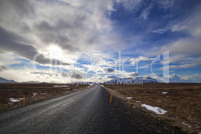 Snowy volcano landscape with dramatic clouds in Iceland
