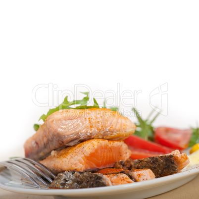 grilled samon filet with vegetables salad