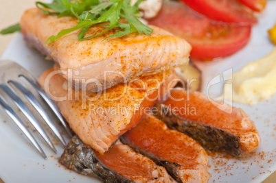 grilled samon filet with vegetables salad