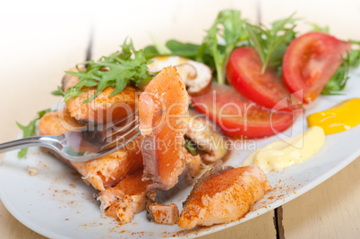 grilled samon filet with vegetables salad