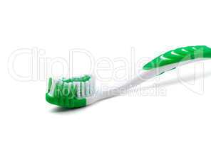 Green toothbrush on white background