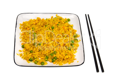 Rice with vegetables and chopsticks