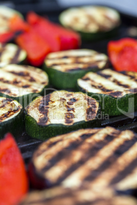 Zucchini eggplant and red pepper on a grill