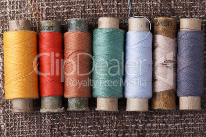vintage bobbins with colorful threads