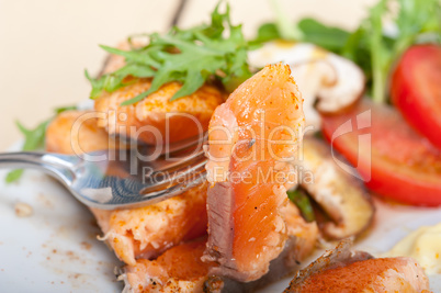 grilled samon filet with vegetables salad