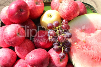ripe red apples and grapes