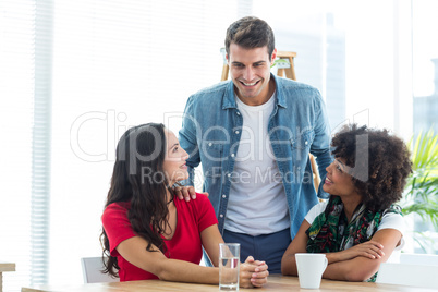 Young colleagues in discussion at office