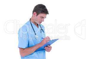 Young nurse in blue tunic writing notes