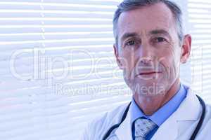 Confident male doctor looking at camera