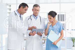 Doctors speaking with nurse
