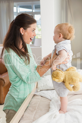 Happy mother with her baby boy