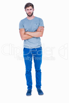 Unhappy handsome man looking at camera with arms crossed