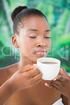 Close up of a beautiful woman drinking coffee