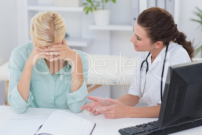 Doctor speaking with her depressed patient