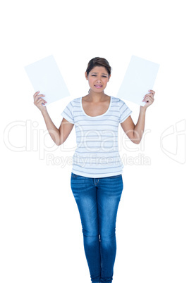 A pretty brunette holding papers