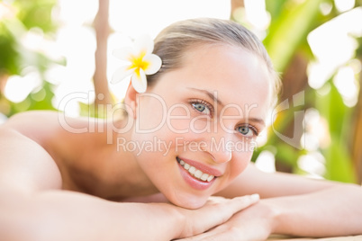 Peaceful blonde lying on massage table