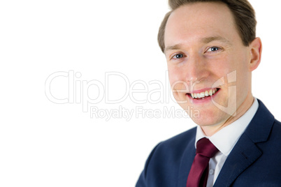 Happy businessman looking at camera