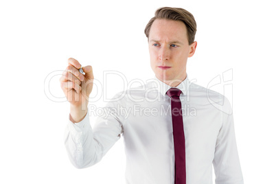 Businessman writing something with chalk