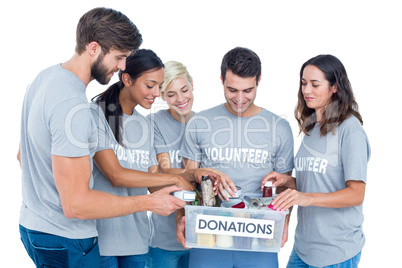 Volunteers friends separating donation stuffs