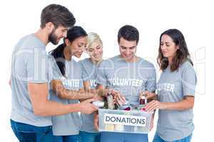 Volunteers friends separating donation stuffs