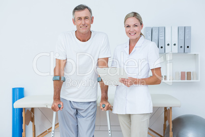Doctor and patient with crunch looking at camera