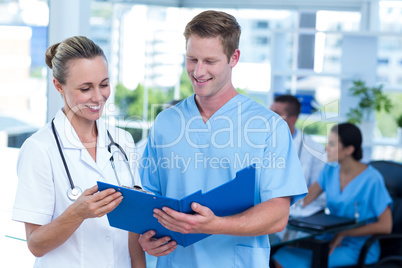 Team of doctors working on their files