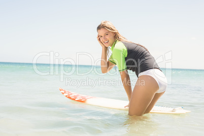 Happy pretty blonde preparing to surf