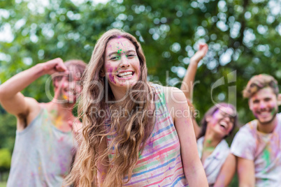 Happy women covered in powder paint