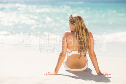 Wear view of blonde woman looking at the sea