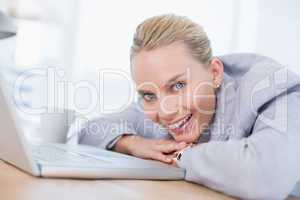 Smiling businesswoman using her computer