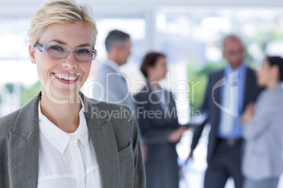 smiling businesswoman looking at the camera