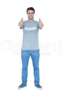 Handsome volunteer gesturing thumbs up