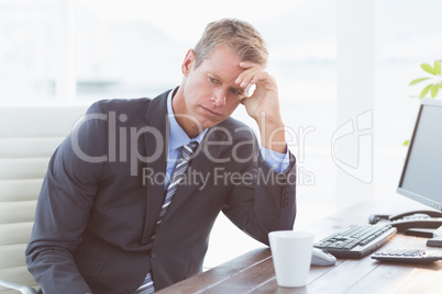 Businessman with his hand on his forehead