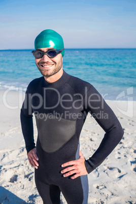 Smiling swimmer getting ready at the beach