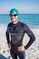 Smiling swimmer getting ready at the beach