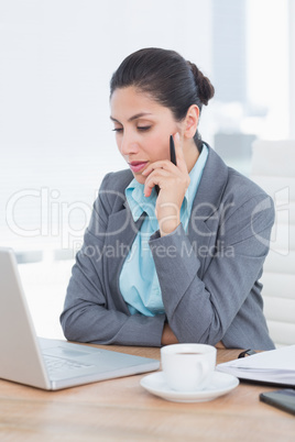 Concentrating businesswoman using her computer