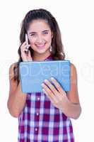 Happy pretty brunette using tablet computer and having phone cal