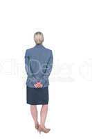Businesswoman standing with hands behind back