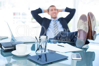 Businessman relaxing in a swivel chair