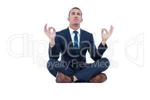 Zen businessman in yoga pose