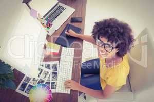 Creative businesswoman typing on laptop