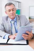 Businessman looking at work schedule